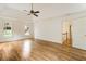 Spacious main bedroom with hardwood floors, tray ceiling, and two large windows at 3646 Sope Creek Farm Se, Marietta, GA 30067