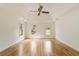 Spacious main bedroom with hardwood floors, tray ceiling, and multiple windows at 3646 Sope Creek Farm Se, Marietta, GA 30067