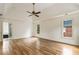 Large main bedroom featuring hardwood floors, tray ceiling, and an ensuite bathroom at 3646 Sope Creek Farm Se, Marietta, GA 30067