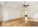 Open-concept main bedroom with hardwood floors, tray ceiling, and attached bathroom at 3646 Sope Creek Farm Se, Marietta, GA 30067