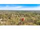 Stunning aerial view of a wooded property featuring a serene pond and a pin drop, highlighting the location at 481 Patillo Rd, Stockbridge, GA 30281