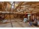 Large unfinished attic space showing exposed wood beams and boarded floor ready for use as storage at 481 Patillo Rd, Stockbridge, GA 30281