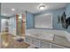 Bathroom showcasing a jacuzzi tub next to a tiled walk-in shower with glass door at 481 Patillo Rd, Stockbridge, GA 30281