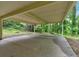 Spacious carport area provides ample covered parking with a beautiful natural backdrop of mature trees at 481 Patillo Rd, Stockbridge, GA 30281