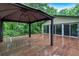 This large deck area features a charming pergola and ample space for outdoor activities with a house view at 481 Patillo Rd, Stockbridge, GA 30281