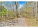 Paved driveway leading to a wooded property, offering a secluded and private setting at 481 Patillo Rd, Stockbridge, GA 30281