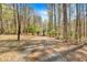 Gated entrance with a unique, decorative metal tree design, adding charm and security to the property at 481 Patillo Rd, Stockbridge, GA 30281