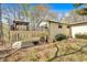 Exterior view showcasing the deck above a covered patio, perfect for outdoor entertaining and relaxation at 481 Patillo Rd, Stockbridge, GA 30281