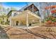 Exterior view showcasing the deck above a covered patio, perfect for outdoor entertaining and relaxation at 481 Patillo Rd, Stockbridge, GA 30281