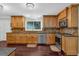 Well-designed kitchen with hardwood floors, stainless steel appliances, and wooden cabinetry at 481 Patillo Rd, Stockbridge, GA 30281