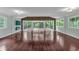 Expansive living area with hardwood floors, lots of windows, and glass doors to the outside deck at 481 Patillo Rd, Stockbridge, GA 30281