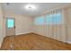 A living room with hardwood floors, natural light, and a front door with decorative glass at 481 Patillo Rd, Stockbridge, GA 30281