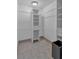 Walk-in closet with white shelving and tile flooring; storage space for organization at 481 Patillo Rd, Stockbridge, GA 30281