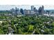 Aerial view of houses and green space in Atlanta, with skyscrapers visible at 432 Ansley Walk Ne Ter, Atlanta, GA 30309