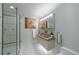 Well-lit bathroom featuring a stand-up shower and a double sink vanity at 432 Ansley Walk Ne Ter, Atlanta, GA 30309
