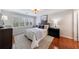 Inviting bedroom with ample natural light from shuttered windows and complemented by hardwood floors at 432 Ansley Walk Ne Ter, Atlanta, GA 30309