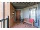 Inviting front porch with brick accents, a cozy bench, and decorative plants creating a warm entrance at 432 Ansley Walk Ne Ter, Atlanta, GA 30309