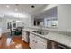 Bright kitchen with granite countertops, stainless steel appliances, and a view to the breakfast nook at 432 Ansley Walk Ne Ter, Atlanta, GA 30309