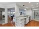 Bright kitchen with granite countertops, stainless steel sink, and an open view to the dining and living areas at 432 Ansley Walk Ne Ter, Atlanta, GA 30309