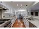 Spacious kitchen with stainless steel appliances, granite countertops, and an open design to the dining area at 432 Ansley Walk Ne Ter, Atlanta, GA 30309