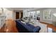 Open-concept living area with hardwood floors, comfortable seating, and natural light highlighting home office at 432 Ansley Walk Ne Ter, Atlanta, GA 30309