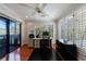Bright office space featuring hardwood floors, shuttered windows, ceiling fan, and a sliding glass door at 432 Ansley Walk Ne Ter, Atlanta, GA 30309