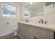 Bathroom featuring a double sink vanity with modern faucets and plenty of storage at 524 S Holly Springs Rd, Woodstock, GA 30188