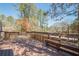 Spacious wooden deck with built-in bench seating, perfect for outdoor entertaining at 524 S Holly Springs Rd, Woodstock, GA 30188