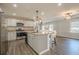Modern eat-in kitchen with stainless steel appliances, granite counters and updated fixtures at 524 S Holly Springs Rd, Woodstock, GA 30188
