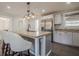 Modern eat-in kitchen with stainless steel appliances, granite counters and updated fixtures at 524 S Holly Springs Rd, Woodstock, GA 30188