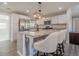 Modern eat-in kitchen with stainless steel appliances, granite counters and updated fixtures at 524 S Holly Springs Rd, Woodstock, GA 30188