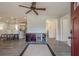 Open-concept living room flowing into the kitchen with luxury vinyl flooring throughout at 524 S Holly Springs Rd, Woodstock, GA 30188