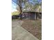 A quaint backyard shed offers additional storage space and complements the property's outdoor appeal at 524 S Holly Springs Rd, Woodstock, GA 30188