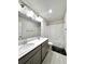 Bathroom featuring double sinks, a large mirror, and a shower with white curtain at 3049 Morgan Spring Trl, Buford, GA 30519