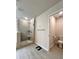 Modern bathroom featuring a glass-enclosed shower with tile surround and a separate toilet area at 3049 Morgan Spring Trl, Buford, GA 30519