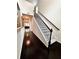 Inviting entryway features hardwood floors, a staircase with iron railings, and natural light at 3049 Morgan Spring Trl, Buford, GA 30519