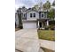 Charming two-story home featuring a two-car garage, well-maintained lawn, and inviting front porch at 3049 Morgan Spring Trl, Buford, GA 30519