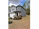 Beautiful two-story home with a stone and siding exterior and a well-manicured lawn at 3049 Morgan Spring Trl, Buford, GA 30519