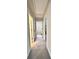 Hallway with access to the laundry room at 3049 Morgan Spring Trl, Buford, GA 30519
