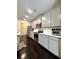 Modern kitchen with stainless steel appliances, ample cabinet space, and sleek countertops at 3049 Morgan Spring Trl, Buford, GA 30519