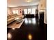 Open concept living room with fireplace, hardwood floors, ample natural light, and cozy seating at 3049 Morgan Spring Trl, Buford, GA 30519