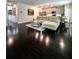 An open-concept living area with hardwood floors and lots of natural light at 3049 Morgan Spring Trl, Buford, GA 30519