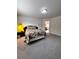 Bright main bedroom featuring light colored carpet, wall art and plenty of space at 3049 Morgan Spring Trl, Buford, GA 30519