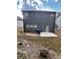 Backyard featuring a brick and stone patio, gray siding, and manicured landscape at 3049 Morgan Spring Trl, Buford, GA 30519