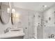 Modern bathroom boasts a marble countertop vanity and glass-enclosed shower at 4000 N Stratford Ne Rd, Atlanta, GA 30342