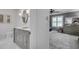 Elegant bathroom features a gray vanity, marble countertop, and oval mirror at 4000 N Stratford Ne Rd, Atlanta, GA 30342
