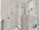Close-up of the elegant, glass-enclosed walk-in shower with marble surround at 4000 N Stratford Ne Rd, Atlanta, GA 30342