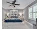 Relaxing bedroom features a ceiling fan, ample natural light, and stylish decor at 4000 N Stratford Ne Rd, Atlanta, GA 30342