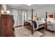 Cozy bedroom featuring hardwood floors, natural light, and a comfortable bed at 4000 N Stratford Ne Rd, Atlanta, GA 30342