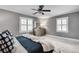 Inviting bedroom with a gray accent wall, a ceiling fan and lots of natural light at 4000 N Stratford Ne Rd, Atlanta, GA 30342